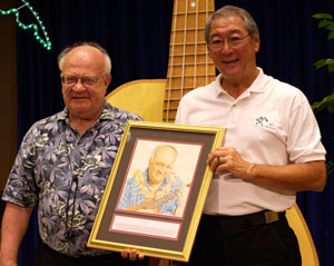 Byron Yasui presenting Lyle with his Ukulele Hall of Fame portrait at the Portland Ukulele Festival, June 2007